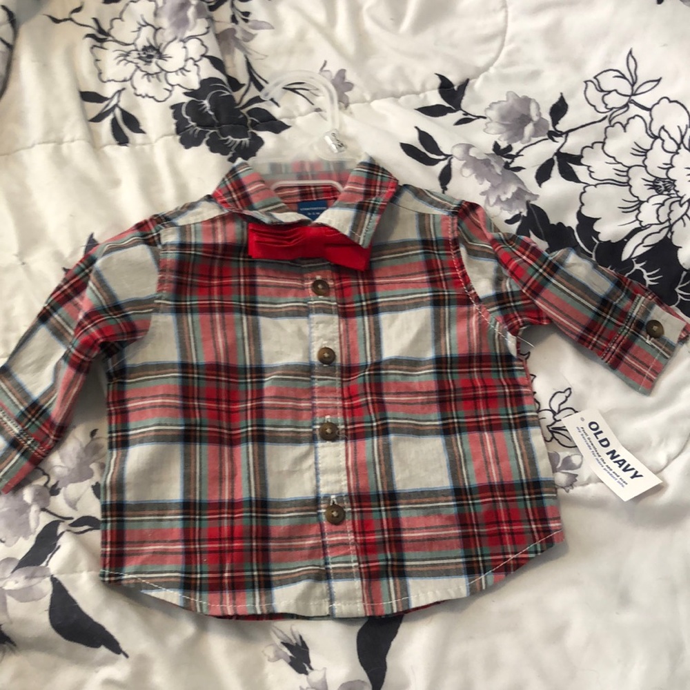 Baby boy, size 0-3 months short. Never been worn. Has a little bow tie